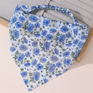 Detail view of a blue floral chiffon hair scarf with elastic band, elegant floral hair accessory.