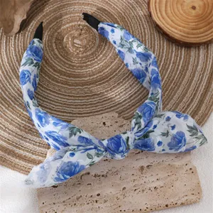 Blue floral chiffon headband with a charming bowknot design, elegant hair accessory.