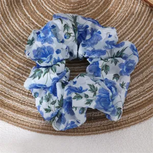 Blue floral chiffon scrunchie detail view, elegant women hair tie for daily wear.