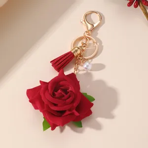 Red rose keychain with tassel and pearl pendant, sweet style bag charm for women fashion items.