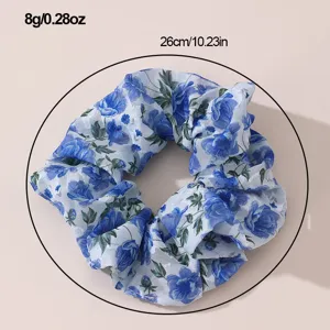 Blue floral chiffon hair scrunchie for women, elegant hair tie accessory for daily wear.
