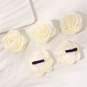 Elegant white fabric rose hair clips, sweet floral side clips for women and girls daily styling.