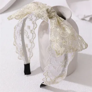 Elegant lace bow headband with delicate gold embroidery, wide hair hoop for women and girls daily.