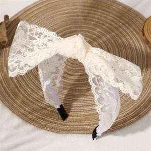 White lace bow headband for women, sweet hair accessory with wide brim and comfortable fit for daily wear.