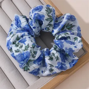 Blue floral chiffon hair scrunchie detail close up, elegant hair tie accessory showcase