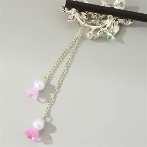 Detailed view of antique floral hairpin with delicate tassel and pearls for Hanfu styling.