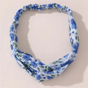 Blue floral print hair band with a stylish twist knot design, lightweight daily wear.