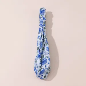 Blue and white floral chiffon hair clip detail shot, elegant elegant bow design for women daily wear.
