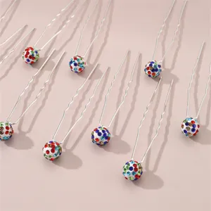 Close-up detail of rhinestone ball U-shaped hair pins, colorful crystal hair accessories.