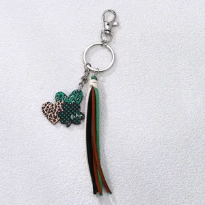 Detail view of St. Patrick's Day clover heart keychain with colorful leather tassels.