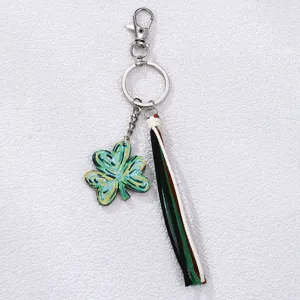 Green clover keychain with colorful tassel, charming St. Patrick's Day bag charm and accessory.
