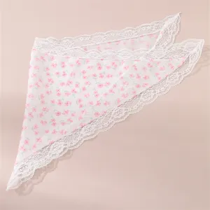 Close-up detail of pink floral pattern hair band featuring delicate white lace trim and sweet style.