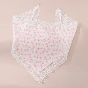 Detail view of sweet floral lace hairband, soft fabric and delicate white lace edge.