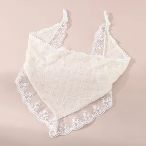 Close-up of the delicate floral lace triangle hair band, featuring intricate embroidery trim.