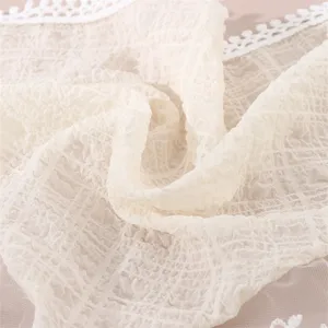 Soft crinkled fabric hair band with elegant white lace trim, fresh style accessory.