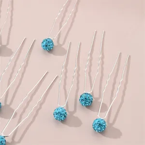 Close-up detail of blue rhinestone U-shaped hairpins, elegant hair fork for daily styling.