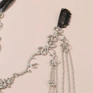 Silver crystal forehead chain hair accessory with butterfly motif and snap clips for styling.