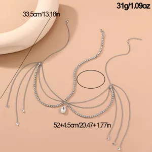 Silver rhinestone forehead chain detail view with crystal drop pendant and multi-layer design.
