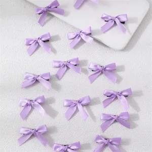 Detail view of purple satin ribbon mini bow hair clips set, sweet style hair accessories.