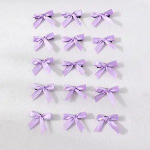 Detailed view of fifteen purple ribbon bow hair clips set, sweet and simple style.
