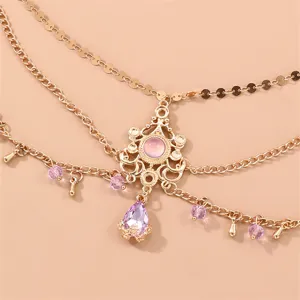 Exquisite crystal forehead chain detail, boho ethnic headpiece with sparkling pink purple rhinestones.