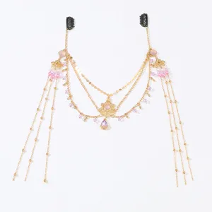 Close-up of vintage crystal forehead chain detail, elegant gold hair jewelry pendant.