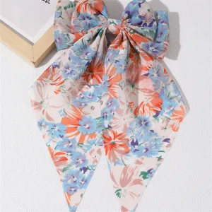 Sweet floral fabric hair bow with long ribbons, elegant spring hair clip for women daily wear.