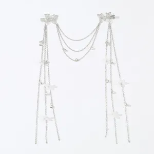 Detailed shot of vintage silver butterfly hair chain with multi-layered hanging chains and flowers.