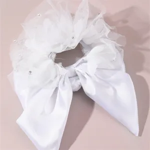Elegant white bridal hair scrunchie with delicate mesh flower layers and satin bow.