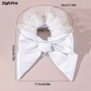 White bridal hair bow detail view, tulle mesh and pearl accents, size and weight specifications.