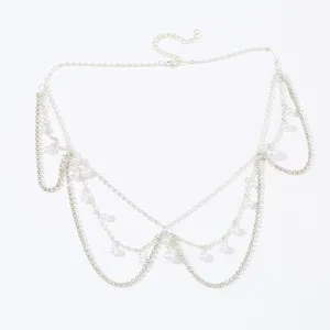 Detailed view of the sparkling crystal rhinestone and pearl forehead chain headpiece accessory.