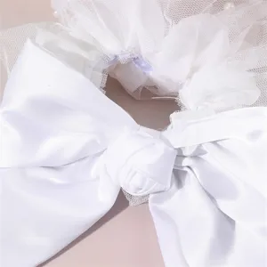 White wedding satin bow hair clip detail shot, elegant mesh pearl hair accessories for women.