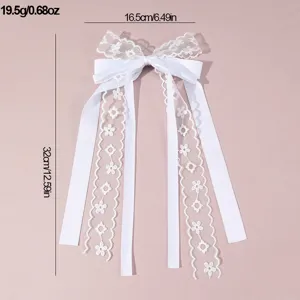 White lace bow hair clip with long streamers, elegant bridal hair accessory for wedding events.