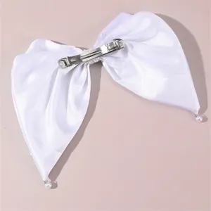 White satin bow hair clip detail shot featuring pearl pendants and durable metal barrette.