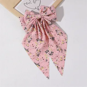 Pink floral fabric hair bow with long tails, sweet elegant spring clip hair accessory.