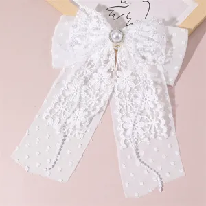 Elegant white lace bow hair clip with pearls and long ribbons for bridal wedding daily use.
