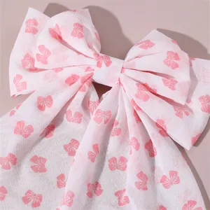 Sweet pink bow hair clip, cute fabric ribbon hair accessory for women and girls.