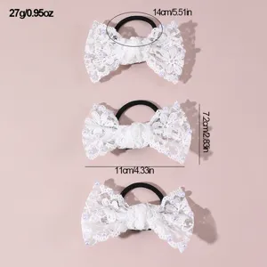 Detailed view of white lace bow hair tie with faux pearls, showing dimensions and fine lace texture.