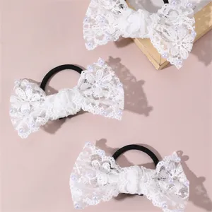 Detailed view of elegant white lace pearl bow hair tie, perfect for bridal and daily wear.