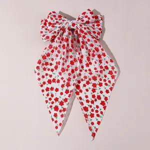 Sweet floral hair bow clip with long tails, chic fabric spring hair clip for women and girls.