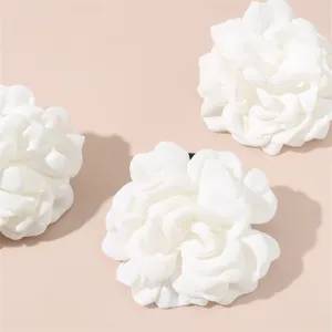 White fabric camellia flower hair tie accessory elegant floral design for women girls.
