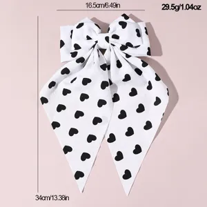 French style black and white heart print fabric bow hair clip with long ribbons detail.