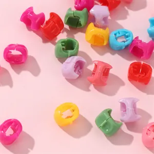 Colorful plastic hair clips for dreadlocks styling, bright small beads set, detail view.