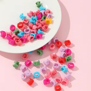 Colorful mini hair claw clips detail shot, perfect for dreadlocks and braided hairstyles styling.