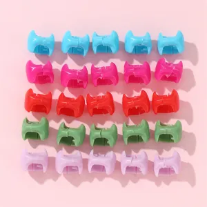 Colorful hair clips set, plastic small dreadlocks braids accessories, vibrant detail shot.