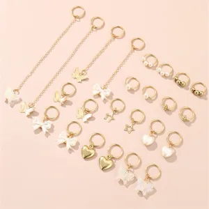 Gold dreadlock hair rings charms detail view with butterfly bow pearl design for DIY braiding.