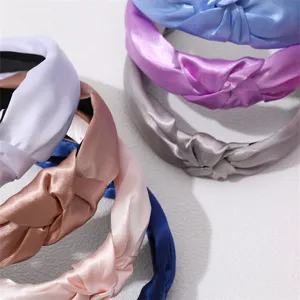 Satin knotted headband detail showing soft fabric texture and vibrant colors for daily wear.