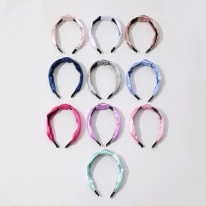 Set of 10 solid color fabric knotted headbands for women, soft and stylish hair accessories.