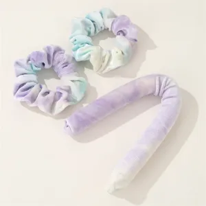 Close up of tie dye velvet heatless curling rod and matching scrunchies set details.