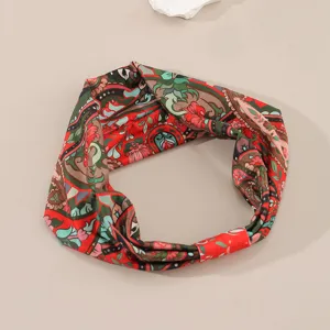 Bohemian retro floral printed fabric headband for women, stylish cross twist hair accessory.